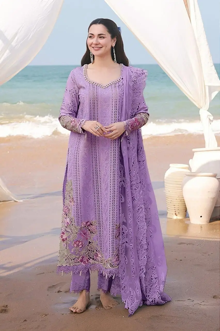 Lavender Luxury Embroidered Lawn Suit for Women Woman wearing lavender embroidered 3 piece lawn suit with matching dupatta at beach