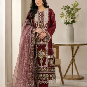 Woman wearing maroon embroidered Pakistani dress with luxury dupatta
